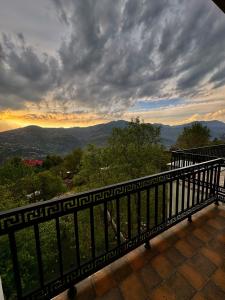 a balcony with a view of the mountains at The Elysian Villa in Murree