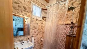a bathroom with a shower curtain and a sink at Casa Boutique Margarita in Peniscola +22 photos