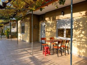 a wooden table and chairs on a patio at Kolhida home in Kilkis