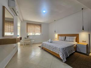 a bedroom with a large bed and a table at Le Diamant in Tétouan