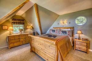 a bedroom with a large bed and a window at Spectacular Mountain View - Cloud 9 - HotTub-PETS OK in Cleveland