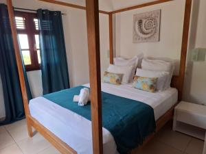 a bedroom with two bunk beds and a mirror at Chalet vue mer, piscine in Saint-Claude