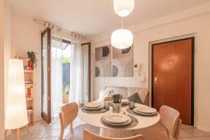 a dining room with a table and chairs at Luxury Garden Suite with Private Heated jacuzzi in Perugia +43 photos