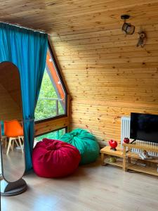 a room with two bean bags in a room with a window at Mtis qokhi Twins in Mtskheta