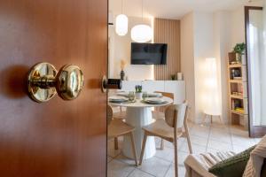 a room with a table and a dining room at Luxury Garden Suite with Private Heated jacuzzi in Perugia
