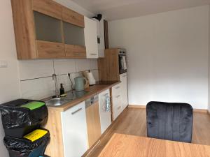 a small kitchen with a sink and a table at Patrycja 2 Top 1 in Ehenbichl