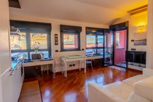 a living room with a couch and a table at Acquarium dream apartment kate in Genoa