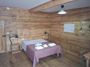 a room with a bed and a table with towels at FISHERMAN Setúbal in Setúbal