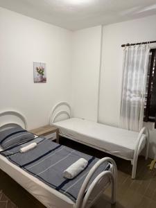 a hospital room with two beds and a window at Vista View Apartments in Risan
