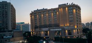 a building with a sign on it in a city at Cairo City Inn Hotel in Cairo