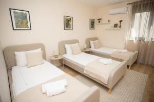 a living room with two beds and a couch at Mostay Boutique Hotel in Mostar +83 photos