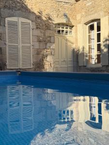 a reflection of a door in a swimming pool at L Epernon in Alençon