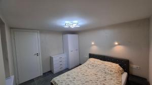 a bedroom with a bed and a ceiling fan at Edelweiss Vila Šventoji in Šventoji +48 photos