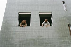 two people looking out the windows of a building at B5 Boutique & Design Hotel - Adults Only in Lugano