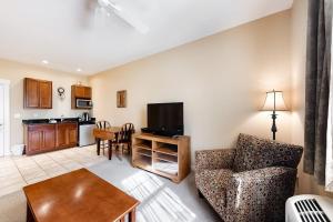 a living room with a couch and a table at Comfortable Suite in Downtown Northeast Harbor w/ WiFi & AC - Walk to the Water in Northeast Harbor