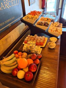 a buffet of fruits and vegetables on a table at Hostal Juan Carlos in Carboneras