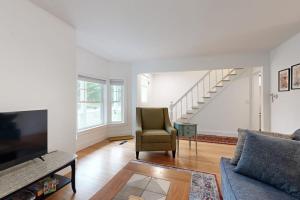 a living room with a couch and a chair at Charming Camden Retreat with Front Porch, Deck and Wifi in Camden
