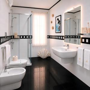 a bathroom with two sinks and two mirrors at UTOPIA "The Art of Bed & Breakfast" in Marigliano