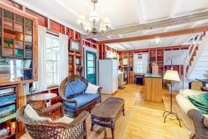a living room with a couch and chairs and a table at Cozy, Waterfront Cabin-Style Gem with Private Dock and Lovely Views in East Harpswell