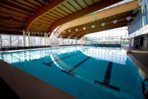 a large swimming pool in a large building at Sottomarina Bungalows Spiaggia in Sottomarina