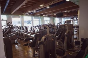 a gym with many rows of treadmills at Sottomarina Bungalows Spiaggia in Sottomarina
