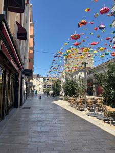 a bunch of umbrellas are flying over a street at La nuit calme in Annemasse