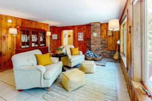 a living room with two couches and a table at Dog-friendly beach house with WiFi, private washer/dryer, deck, beautiful views in Bristol +26 photos