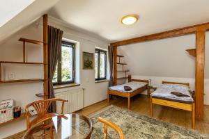 a living room with a table and chairs at Apartmány Havana in Český Krumlov