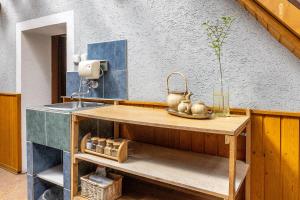 a kitchen with a sink and a counter top at Apartmány Havana in Český Krumlov +130 photos