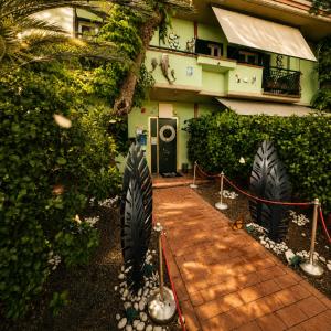a house with a brick walkway in front of it at UTOPIA "The Art of Bed & Breakfast" in Marigliano +10 photos