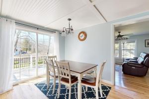 a dining room with a table and chairs at Dog-friendly home with deck, pool table, & firepit - walk to downtown Boothbay in Boothbay Harbor +16 photos