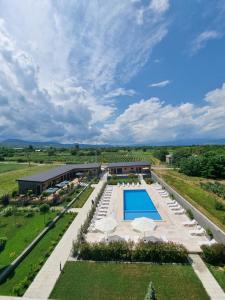 an aerial view of a resort with a swimming pool and lawn at Verde Resort in Ikalto