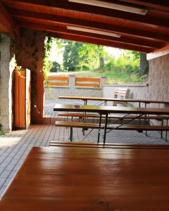 a group of tables and benches on a patio at Penzion Hejtman in Chlum u Třeboně