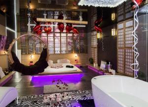 a bathroom with a tub and a room with a bath tub at Grey Champagne Spa by Secret Apartament in Gdańsk +85 photos
