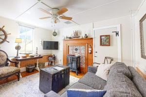 a living room with a couch and a fireplace at Nautical vacation rental in in walkable downtown with harbor view, grill & deck in Boothbay Harbor +40 photos