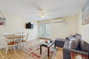 a living room with a couch and a table at New Condo w/Water-View Deck in Edgecomb in Edgecomb