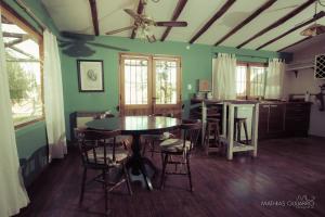 a kitchen with a table and chairs in a room at La Caballeriza Posada Boutique in San Rafael