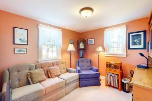 a living room with a couch and a chair at Comfortable home near the beach - dog-friendly - full kitchen & washer/dryer in Rockland