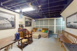 a living room with a couch and a table at Comfortable home near the beach - dog-friendly - full kitchen & washer/dryer in Rockland +21 photos