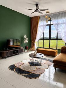 a living room with a couch and a table at klebang Beachfront Homestay I Snooker I Massage Chair I Pool in Malacca