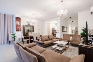 a living room with a couch and a dining room at Kalpazo White Stones in Palasë