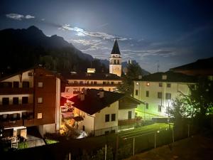 a view of a city with a church at La Nicchia in Pieve di Cadore
