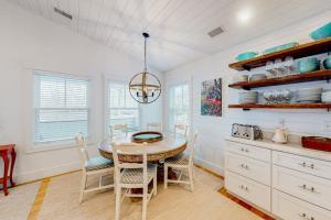 a kitchen with a table and chairs in a room at Perfectly Located Retreat with Grill, Fireplace, & Chef in Boothbay Harbor
