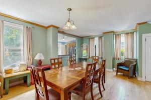a dining room with a wooden table and chairs at Dog-Friendly House with WiFi and Deck - Near the Water, Eateries, and Shopping in Bar Harbor