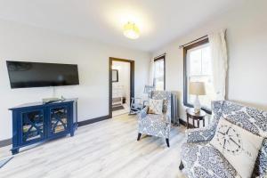a living room with a couch and chairs and a tv at Newly Renovated Haven w/ Deck, Walk to Shops, Dining & Marina, Pet friendly in Boothbay Harbor