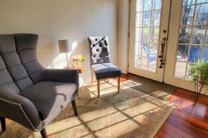 a living room with a couch and a chair and a window at Classic home with prime location 1 block from Main Street in Bucksport