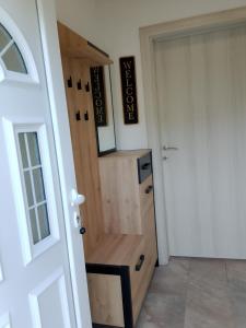 a room with a wooden door in a room at House Vasilije in Žabljak +6 photos