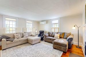 a living room with two couches and a rug at Classic home with prime location 1 block from Main Street in Bucksport