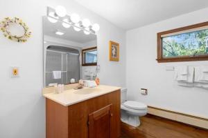 a bathroom with a sink and a toilet at Clark Point Cottage, ocean access, panoramic views in Clark Island +28 photos