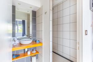 a bathroom with a sink and a mirror at Hôtel Château La Chèze - Bordeaux Floirac in Floirac +54 photos